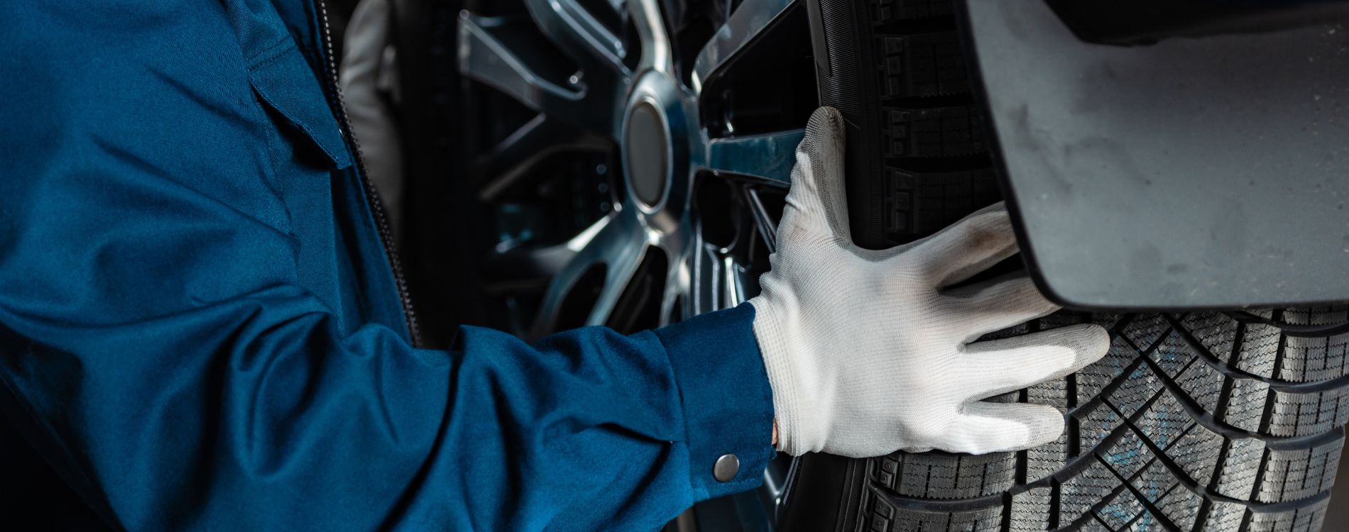 Technician checking a tire and wheel