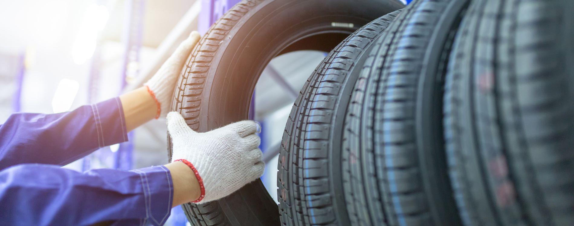 Technician checking a tire in a service shop